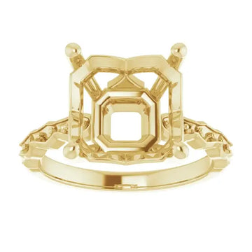Gold engagement ring setting with French-set design and square asscher stone mounting with decorative side accents.