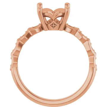 Rose gold engagement ring setting with oval stone head, decorative prongs, and textured band.