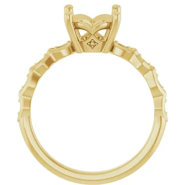 Yellow gold engagement ring setting with oval stone holder and textured band sides.