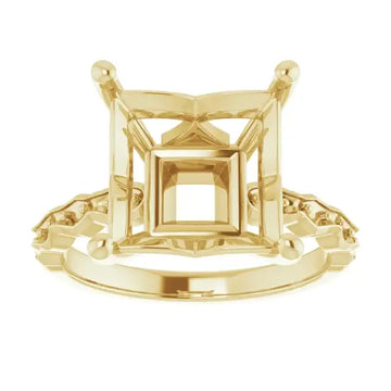 Yellow gold engagement ring setting with square stone holder and French-set accent stones on band.