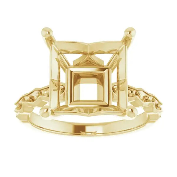 Yellow gold engagement ring setting with square stone holder and French-set accent stones on band.