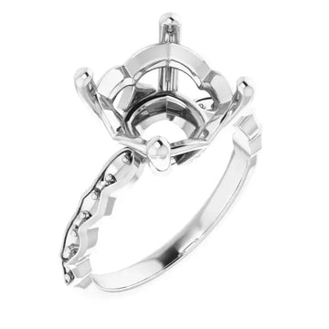 White metal engagement ring setting with French-set accent stones on the band and ornate cushion-cut stone holder.