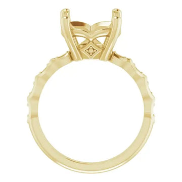Yellow gold engagement ring setting with French-set diamonds along the band and crisscross prongs for cushion stone placement