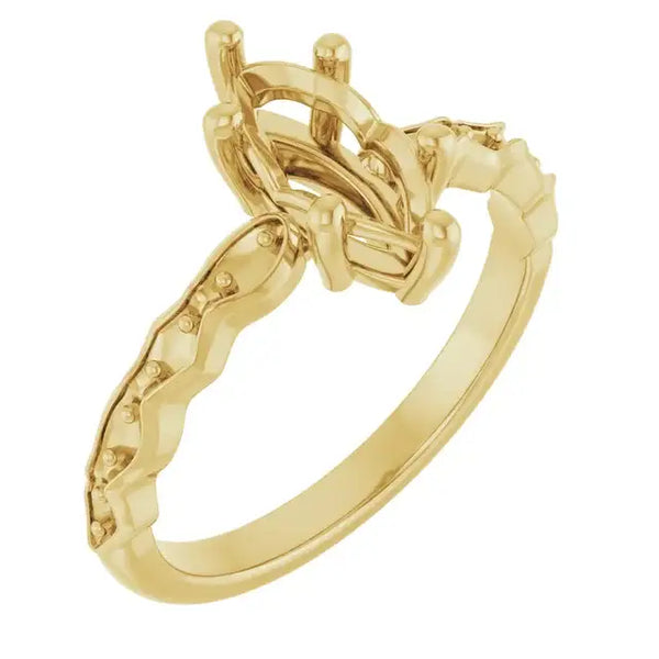 Gold engagement ring setting with French-set stones on shoulders and oval-shaped center stone holder.