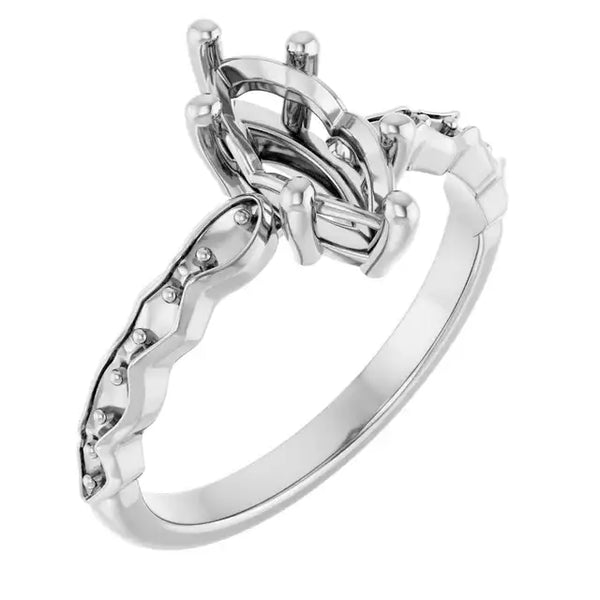 White metal engagement ring setting with oval stone holder and French-set accent diamonds along the band.