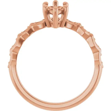 Rose gold engagement ring setting with French-set diamonds along band and prong head for oval stones.
