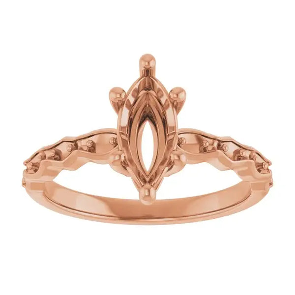 Rose gold engagement ring setting with marquise-shaped center stone and decorative side accents.