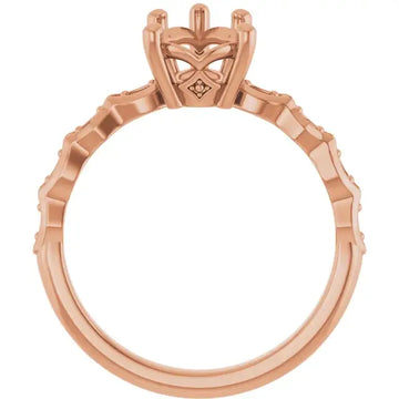 Rose gold engagement ring setting with geometric pear-shaped stone head and textured band.