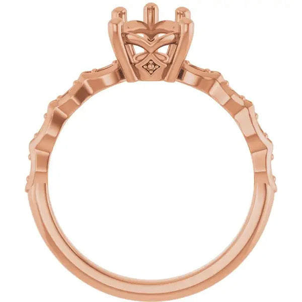 Rose gold engagement ring setting with geometric pear-shaped stone head and textured band.