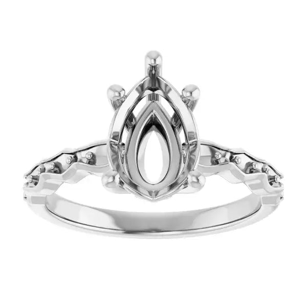 White metal engagement ring setting with pear-shaped center stone basket and accent stones on band.