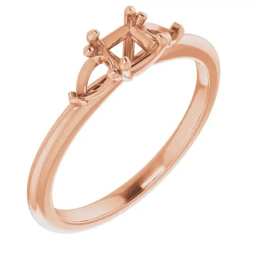 Rose gold engagement ring setting with square stone holder and decorative side details.