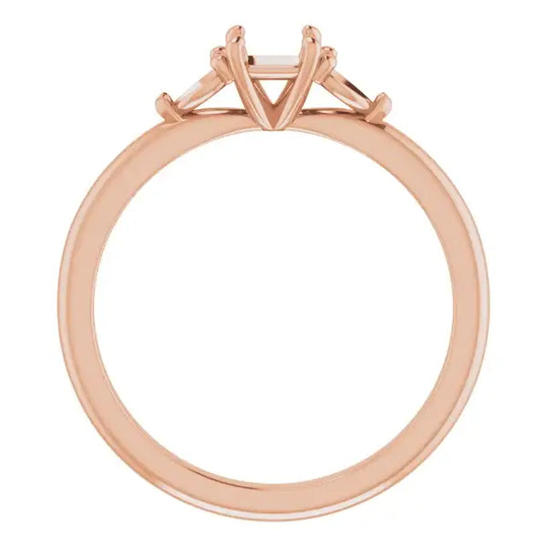 Rose gold engagement ring setting with square stone holder and four prong design, shown from above.
