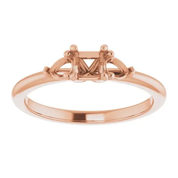 Rose gold engagement ring setting with square center stone mount and decorative side accents.