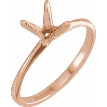 Rose gold engagement ring setting with four-prong round stone holder and polished band.