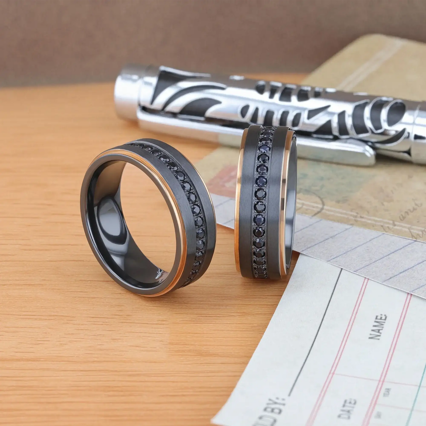 ASTRO Flat Brushed Black Titanium Ring with Rose Gold Plated Edge and Black Sapphire Settings All Around - 8mm - Larson Jewelers