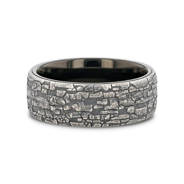Flat lay view highlighting the ring’s black tungsten interior and antique silver stonework exterior
