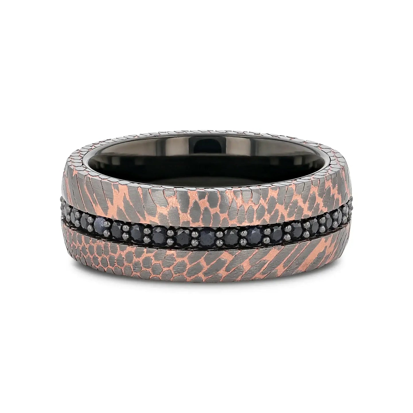 Flat lay of the ring highlighting the continuous black sapphire channel and the two-tone superconductor texture