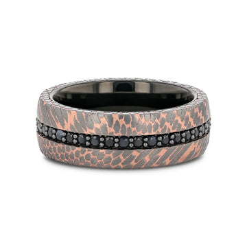 Flat lay of the ring highlighting the continuous black sapphire channel and the two-tone superconductor texture