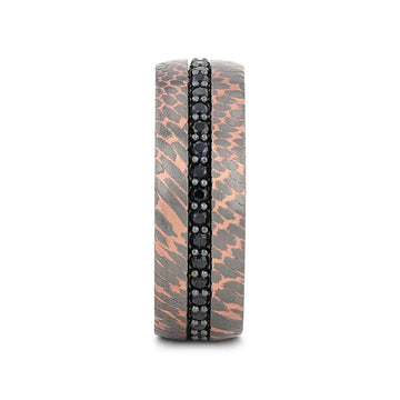Front view showing the centered black sapphire inlay running around the ring with textured superconductor pattern