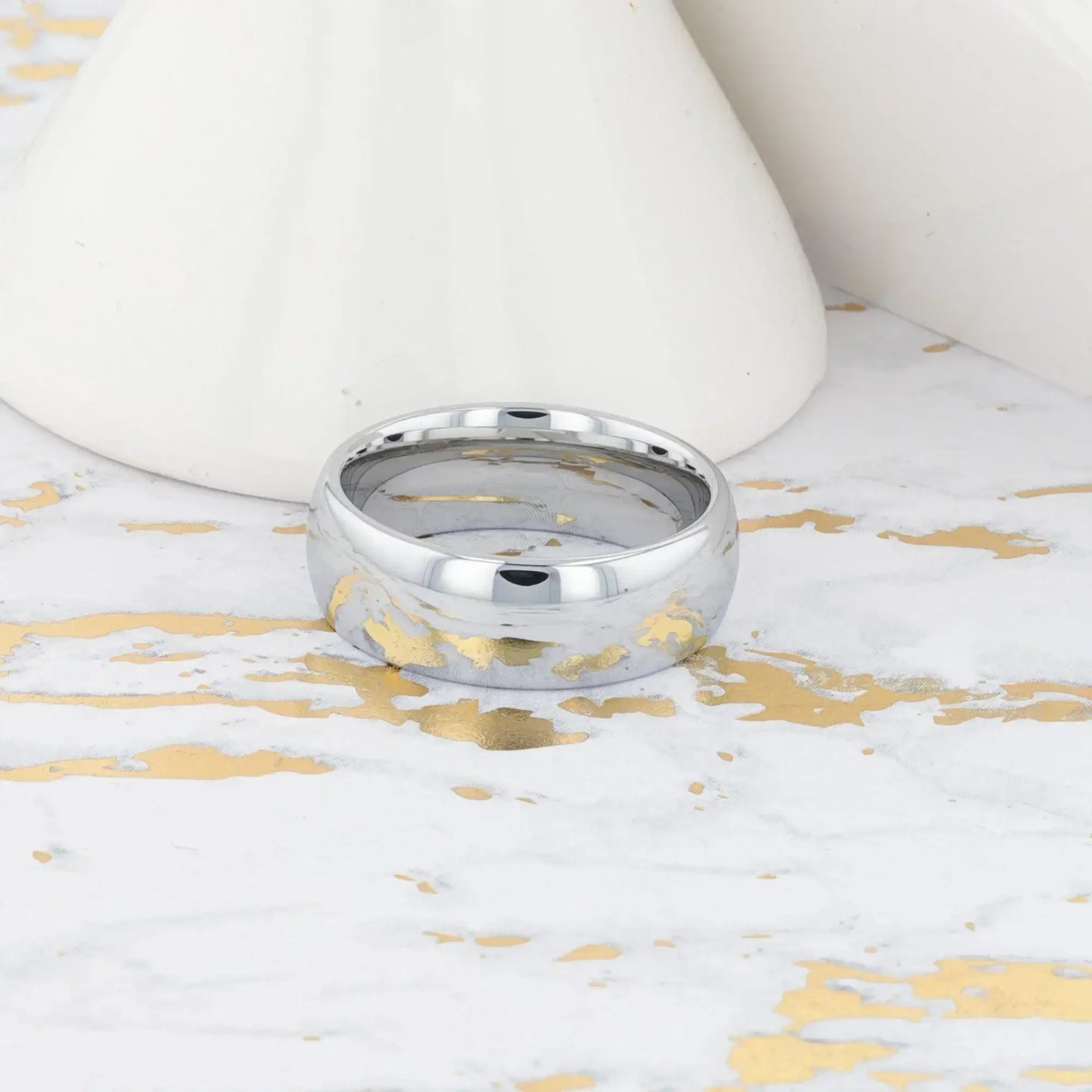DOMINUS domed tungsten carbide ring, isolated angled view on white background