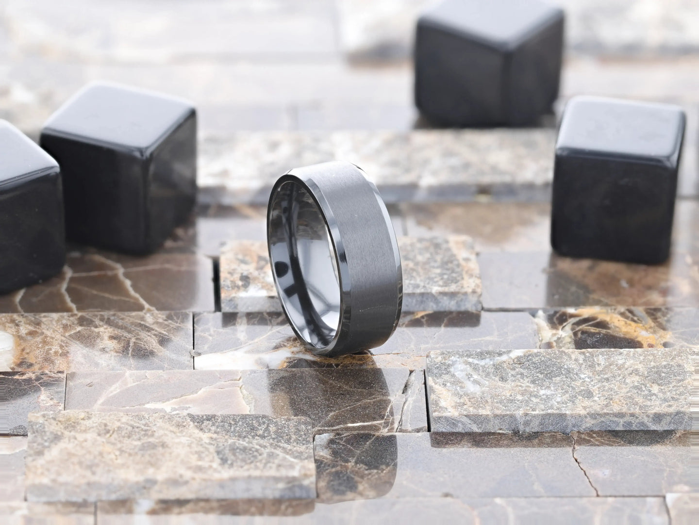 Side angle showing comfort-fit inner shank on black titanium ring, 8mm