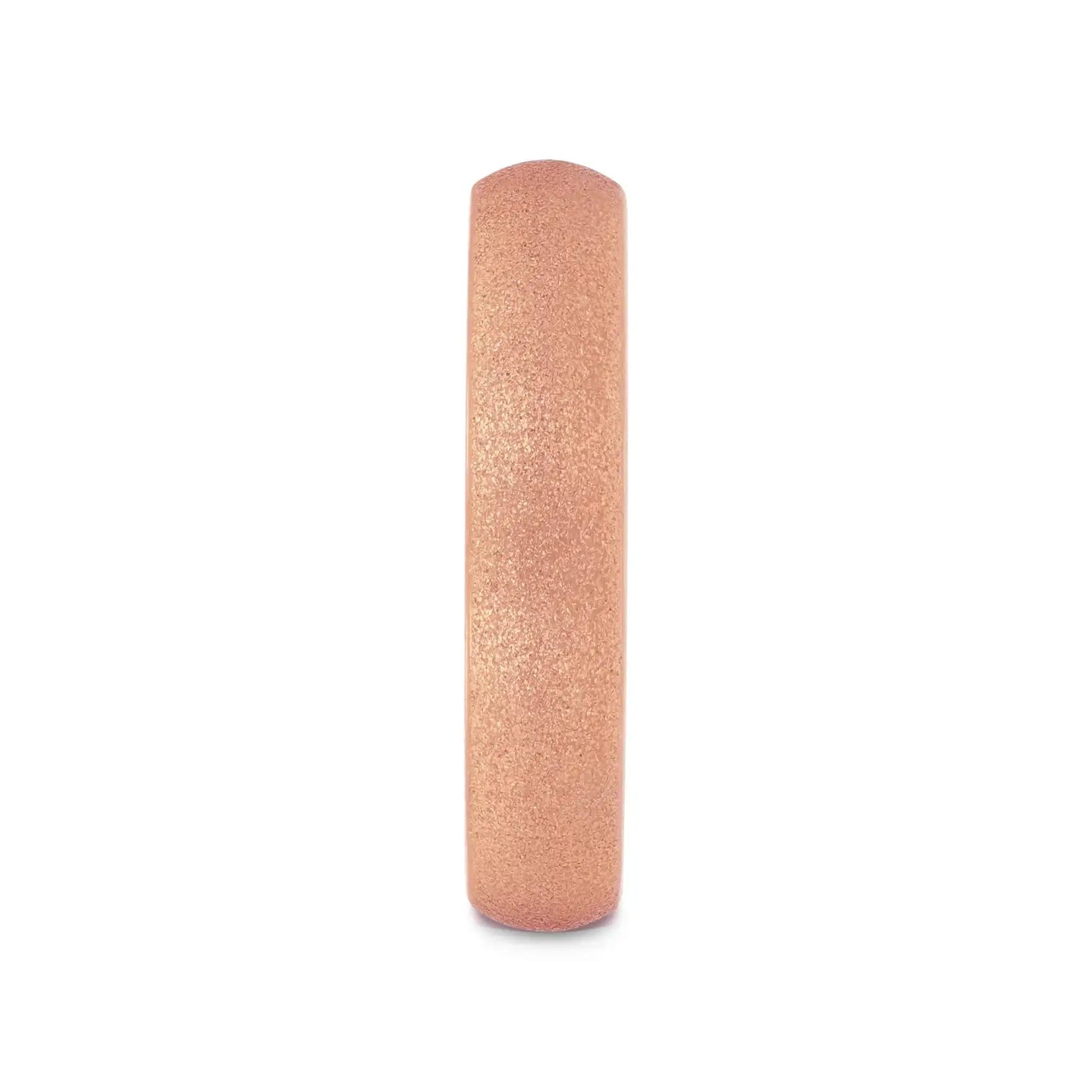 Front-on view of the rose gold sandblasted domed tungsten carbide band highlighting the fine crystalline texture.