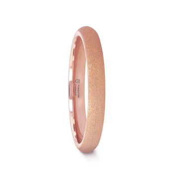 Rose gold plated domed tungsten carbide ring with sandblasted crystalline texture, 4mm width, comfort-fit interior showing “Tungsten Carbide” marking.