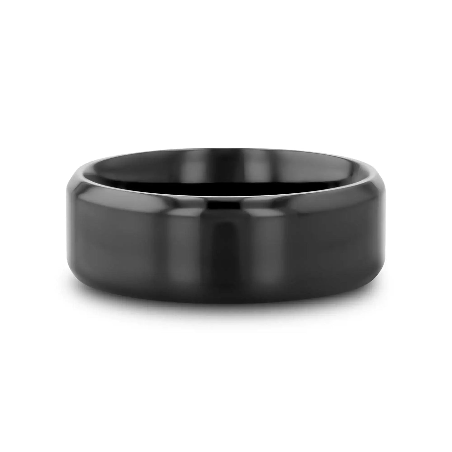 Front view of the black titanium beveled wedding band lying flat, showing domed center and beveled shoulders.