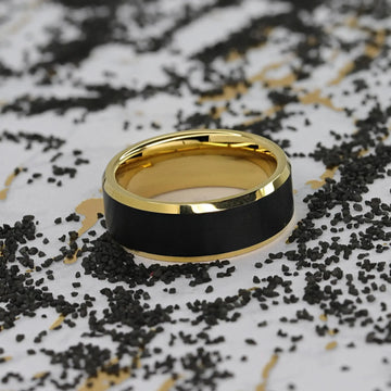 Ring displayed in a cream jewelry box, showing interior gold finish and black brushed exterior center