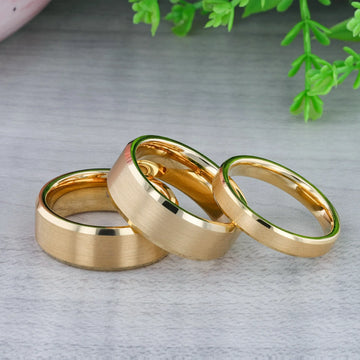 Gold-plated tungsten ring presented in a cream jewelry box, highlighting polished beveled edges.
