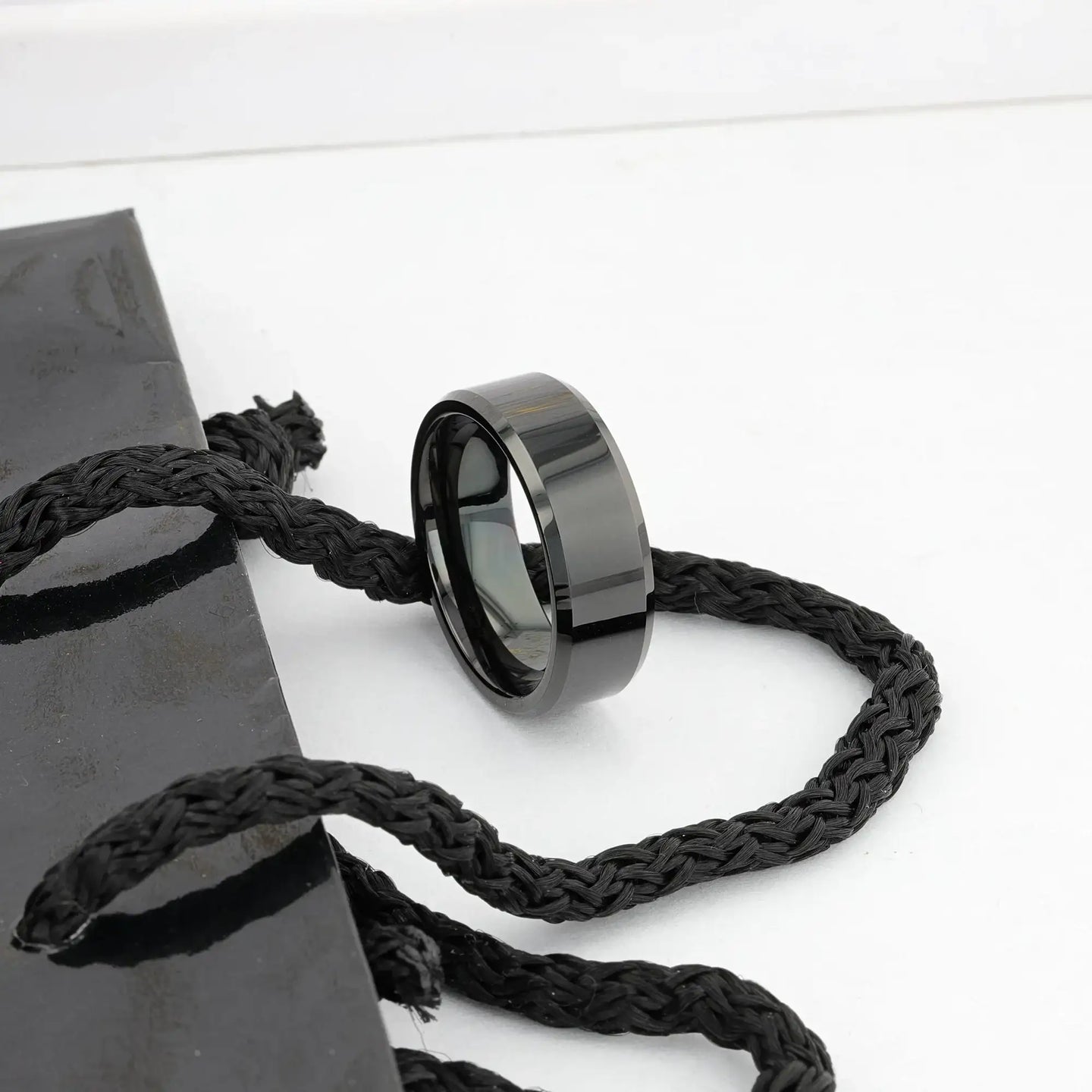 Graphic render of the INFINITY black tungsten ring illustrating beveled edges and comfort-fit interior