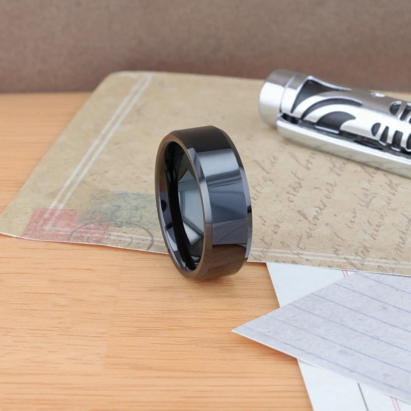 Alternate graphic render showing the INFINITY black tungsten ring’s profile and beveled edges
