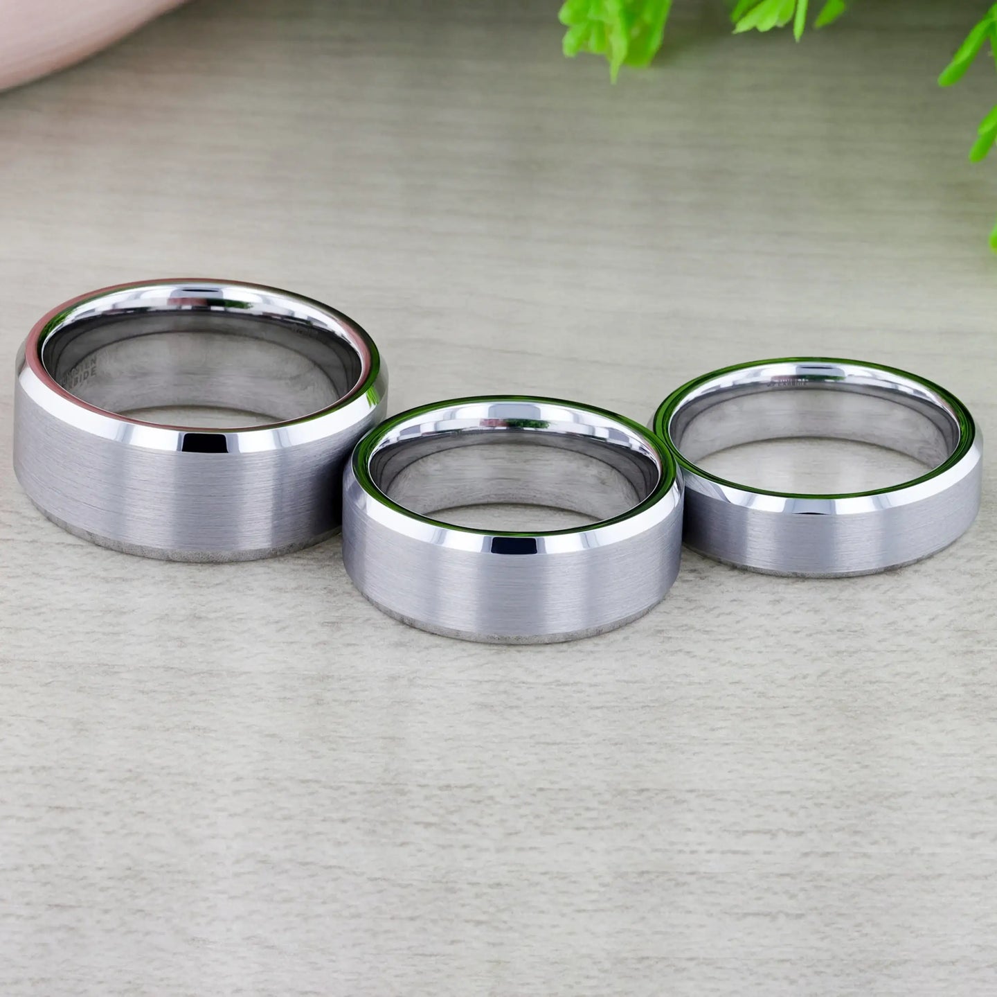 Three widths of the Sheffield tungsten ring side by side, each with brushed centers and polished beveled rims