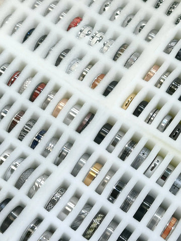 Collection of various rings on a white grid background
