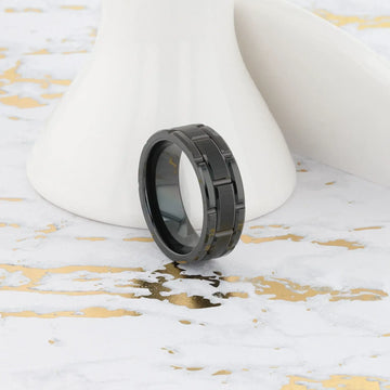 WINDSOR ring on a marble-accent surface showing reflective polished edges