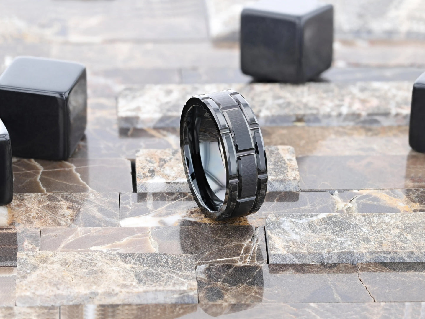 WINDSOR ring on a textured stone background emphasizing the geometric groove design