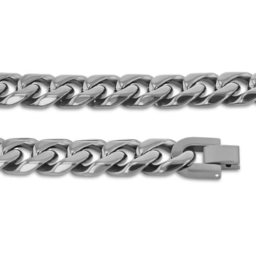 Flat lay of stainless steel Cuban link chain segments highlighting links and clasp detail