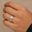 The ABRAMS 8mm white tungsten ring with brushed center and polished edges shown on a hand
