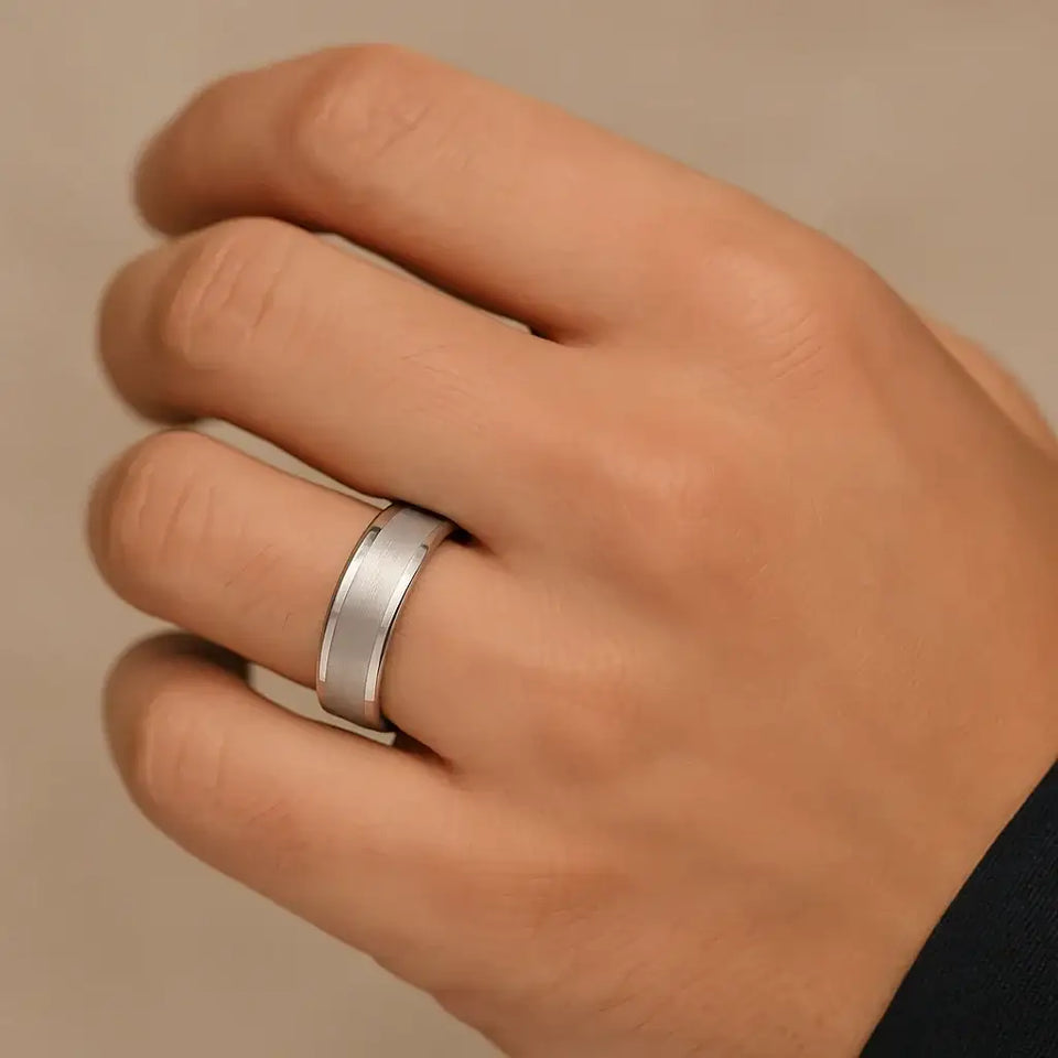 The ABRAMS 8mm white tungsten ring with brushed center and polished edges shown on a hand