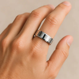 Tungsten carbide polished 8 mm beveled-edge ring shown worn on a hand