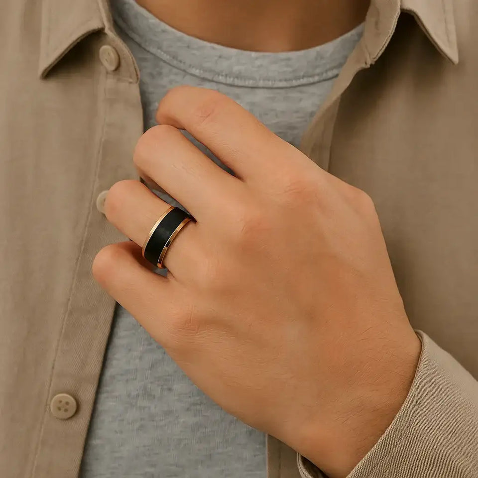 Man wearing a rose gold and black tungsten ring on his ring finger, lifestyle view