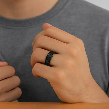 Top-down view of the WINDSOR black tungsten carbide band highlighting the alternating groove pattern