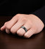 Lifestyle view of the Damascus-pattern black tungsten carbide ring worn on a hand