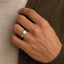 Lifestyle shot of the FAIRFIELD 8mm satin finish titanium ring worn on a hand