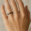 Black 2 mm brushed ceramic band worn on a hand, showing slim flat profile