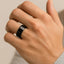CITAR polished black ceramic ring with beveled edges, 10mm width, shown on hand