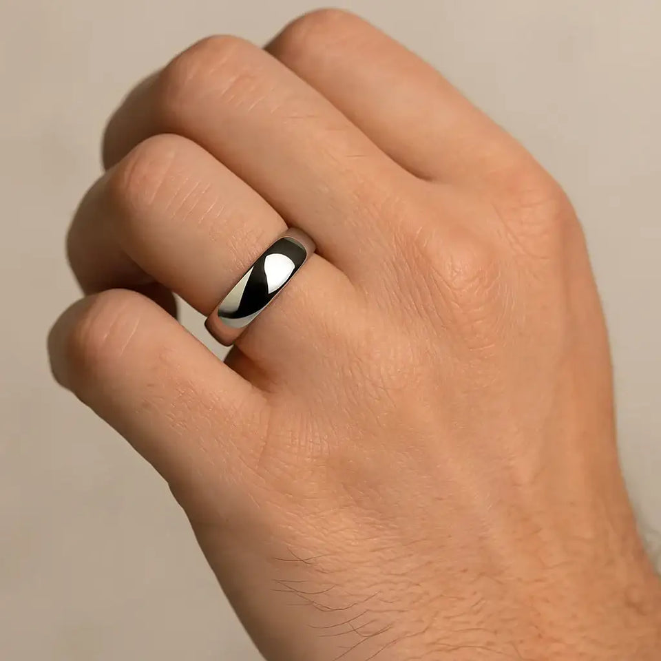 Domed polished cobalt ring worn on a hand to show fit and shine