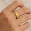 Hand wearing the MUSE 8mm gold-plated titanium ring showing the flat profile and beveled edges