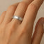 14k white gold milgrain-edge brushed wedding band shown on hand