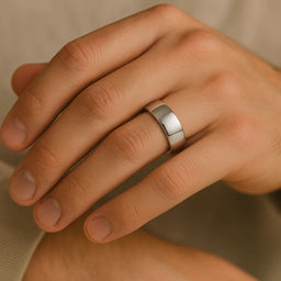 Polished cobalt 7mm wedding band worn on a hand, showing comfort-fit interior